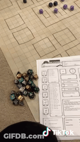 Person Playing Dice With Paper Saying Beyond GIF