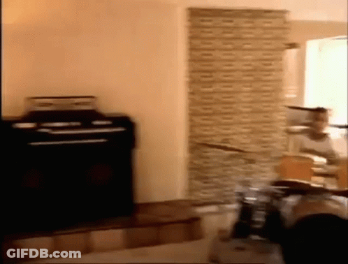 Person Playing Drums In Brick Wall Room GIF
