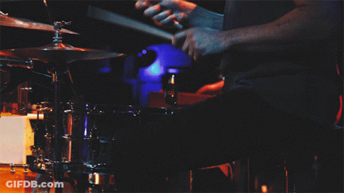 Person Playing Drums With Blue Light GIF