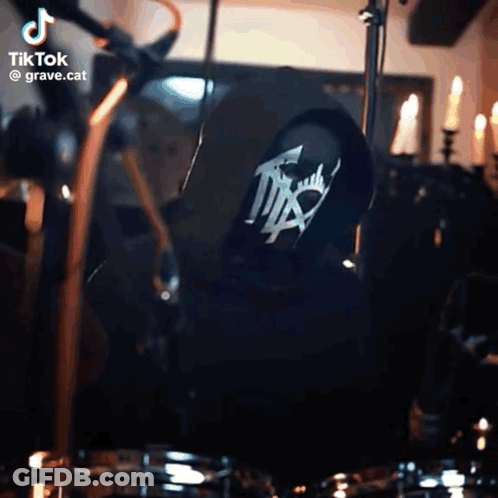Person Playing Drums With Grave.cat GIF