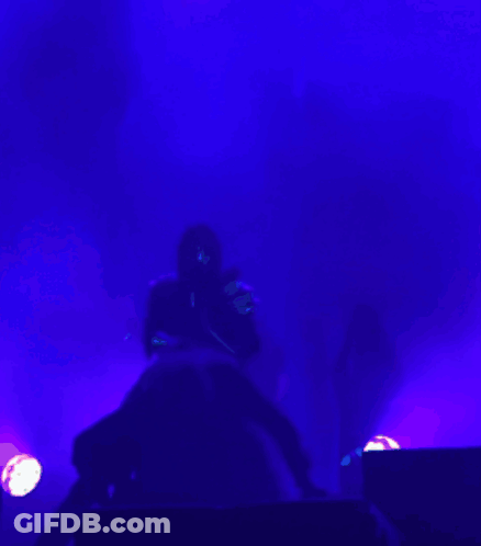 Person Playing Guitar In Dark Room With Purple Lights GIF