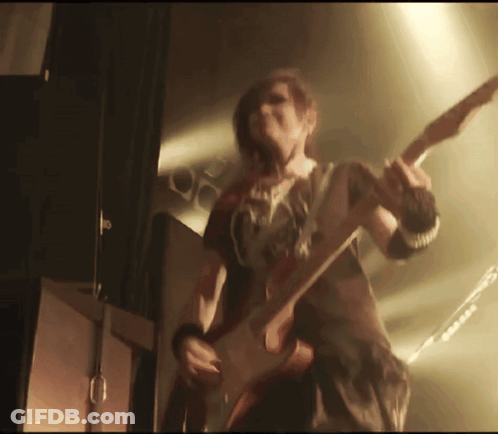 Person Playing Guitar With G On Chest GIF
