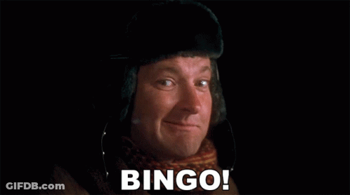 Person Playing Meat Raffle With Gold Spinner GIF