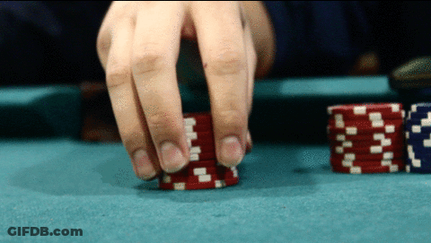 Person Playing Poker With Red And White Chips GIF