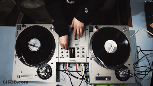 Person Playing Records On Technics Turntables GIF