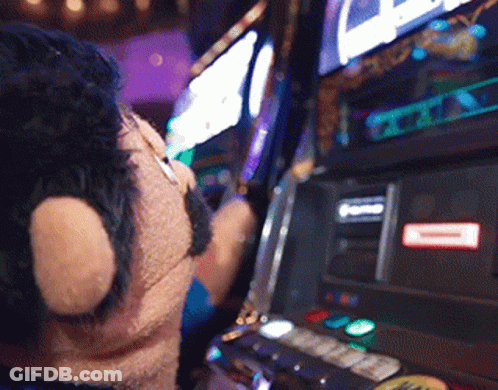 Person Playing Slot Machine With Red A Sticker GIF