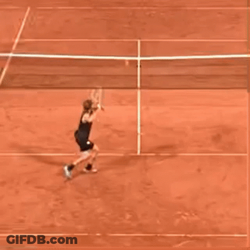 Person Playing Tennis On Red Clay Court GIF