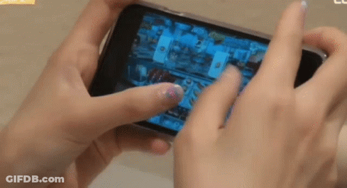 Person Playing Video Game On Cell Phone GIF