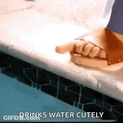 Person Pointing At Pool Drinks Water Cutely GIF