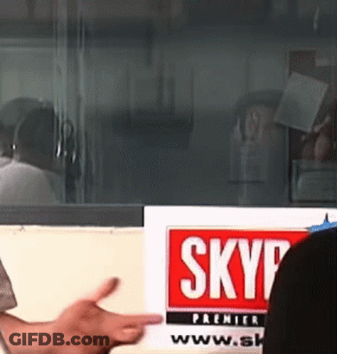 Person Pointing At Skyp Sign In Front Of Window GIF