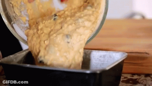 Person Pouring Batter Into Loaf Pan GIF