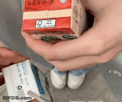 Person Pouring Chocolate Into Cupcake Pan GIF