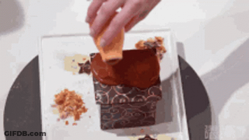 Person Pouring Chocolate On Cake GIF