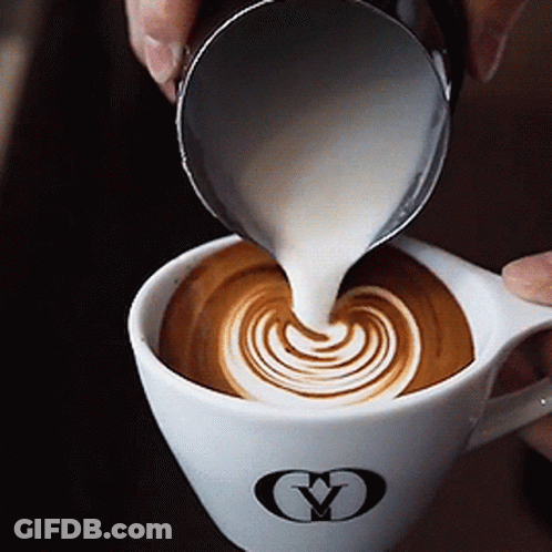 Person Pouring Milk Into Cup Of Coffee GIF