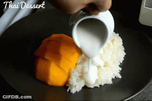 Person Pouring Milk On Thai Dessert GIF