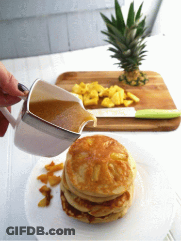 Person Pouring Sauce On Pancakes GIF