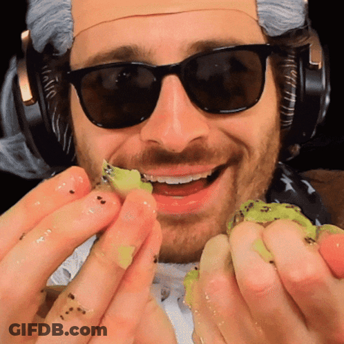 Person Pouring Smoothie Into Glass With Kiwi GIF