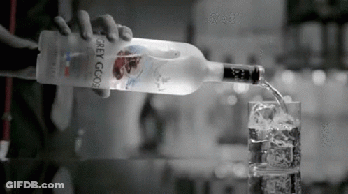 Person Pouring Vodka Into Glass GIF