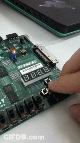 Person Pressing Button On Nexyb3 Board GIF
