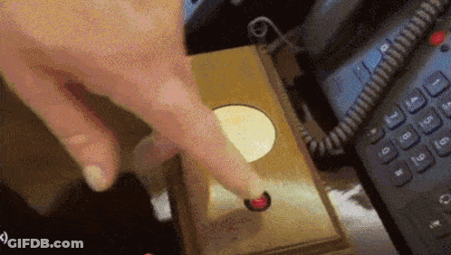 Person Pressing Phone Button Next To Calculator GIF