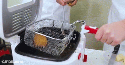 Person Putting Food Into Fryer GIF