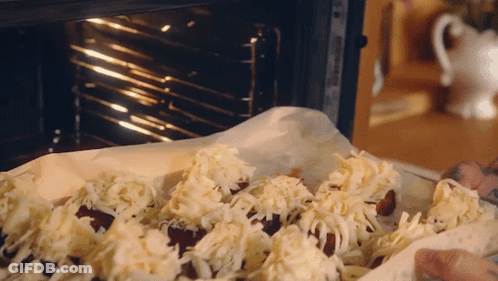 Person Putting Food With Cheese In Oven GIF