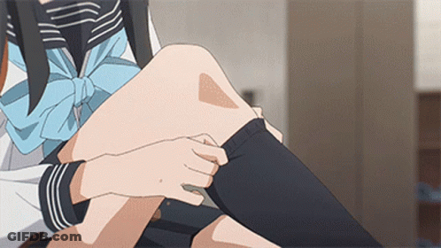 Person Putting On Black Fruit Of The Loom Socks GIF