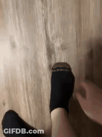 Person Putting On Black Socks Fruit Of The Loom GIF