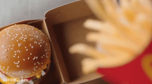 Person Reaching For Hamburger And Fries GIF