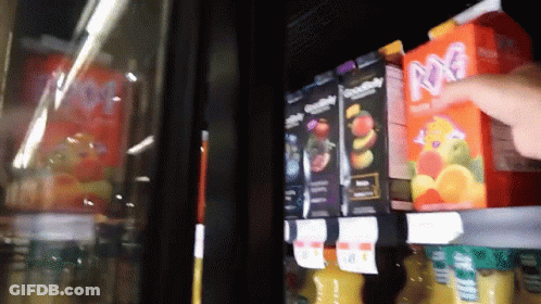 Person Reaching For M&M Juice Box In Store GIF