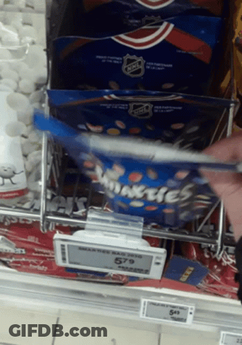 Person Reaching Into Bag Of Minties GIF
