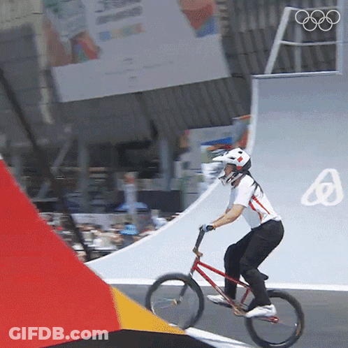 Person Riding Bike Down Ramp Olympics Logo GIF