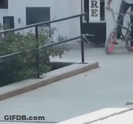 Person Riding Bike On Ramp With Re Sign GIF