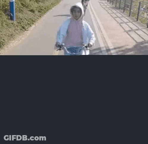 Person Riding Bike With Basket GIF
