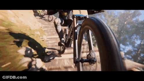 Person Riding Bike With Number 1 GIF