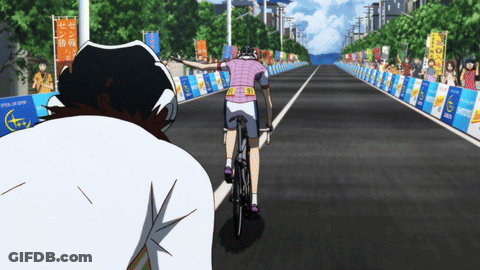 Person Riding Bike With Tokyo Marathon Banner GIF