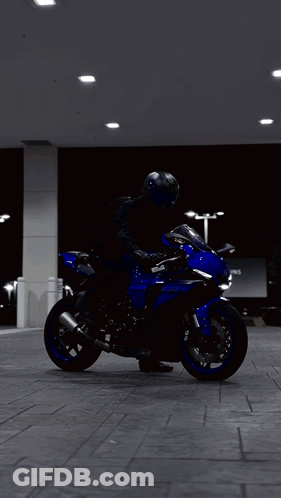 Person Riding Blue Yamaha Motorcycle GIF