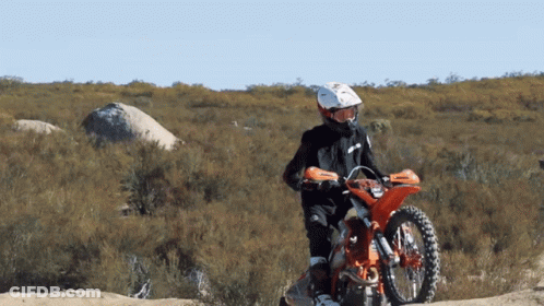 Person Riding Dirt Bike In Desert GIF