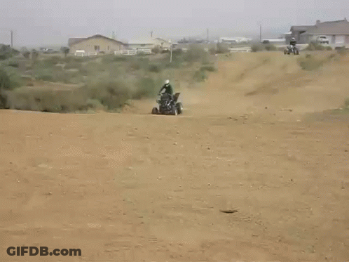 Person Riding Dirt Bike On Dirt Road With House GIF