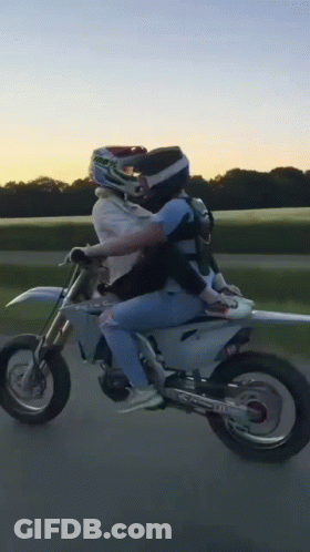 Person Riding Dirt Bike With Passenger GIF