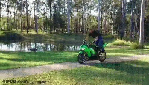 Person Riding Green Motorcycle On Path GIF