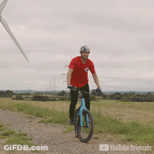 Person Riding Green Motorcycle On Path GIF