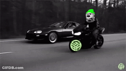 Person Riding Motorcycle Next To Car On Highway GIF