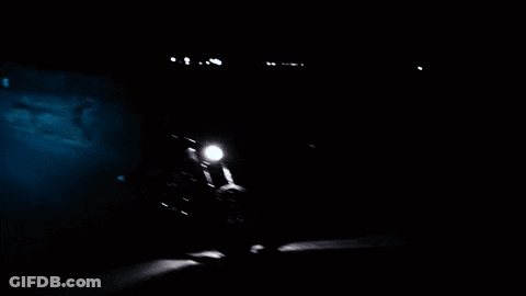 Person Riding Motorcycle On Dark Road GIF