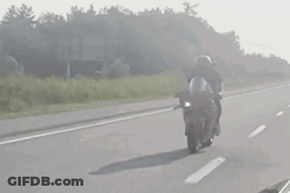 Person Riding Motorcycle On Highway GIF