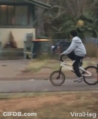 Person Riding Motorcycle Past Building Saying A & A GIF
