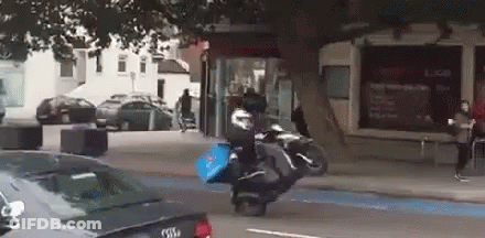 Person Riding Motorcycle With Domino's Pizza Bag GIF