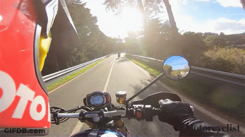 Person Riding Motorcycle With Moto Helmet GIF