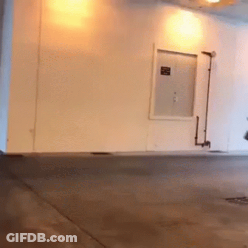 Person Riding Scooter In Garage GIF