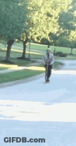 Person Riding Scooter GIF